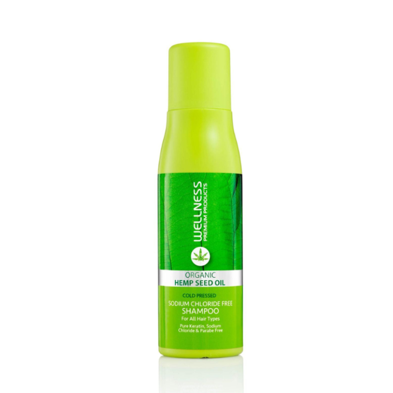 Green bottle of Wellness Organic Hemp Seed Oil on a white background