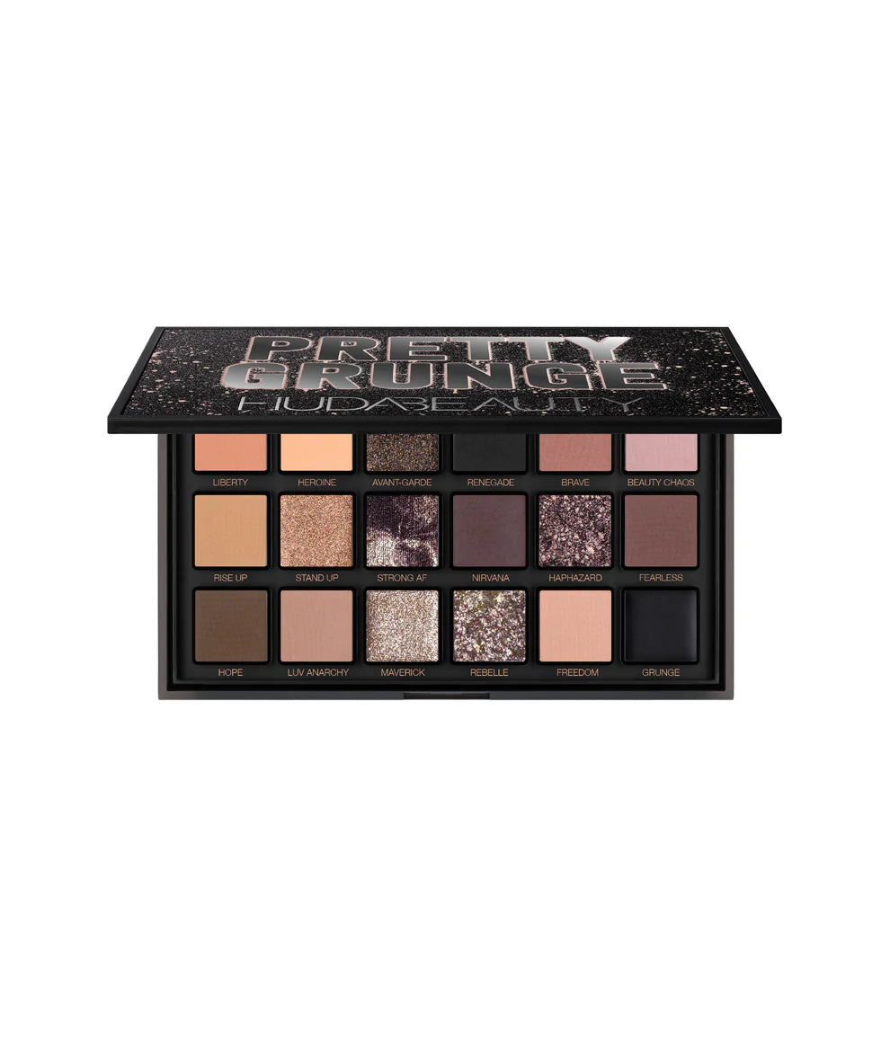 Nude and shimmery Makeup palette with various black brown tones.