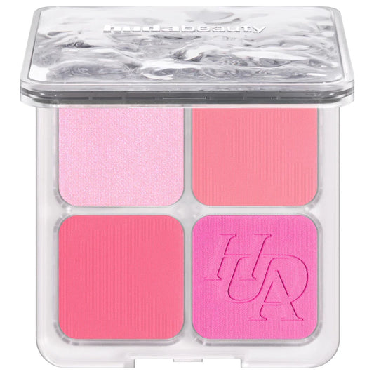 Makeup palette with four pink shades in a clear container, featuring the Urban Decay logo.