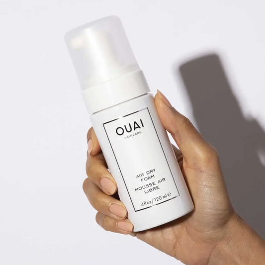 White bottle, Black captions,  pump cap, OUAI Air Dry Foam 