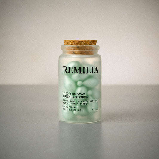 Jar of Remilia hair serum on a gray background