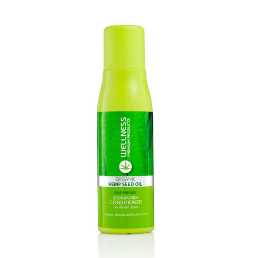 Green bottle of Wellness Organic Hemp Seed Oil on a white background